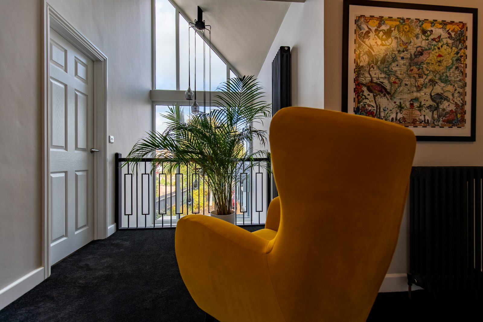 Renovated period living room with restored cornicing, fireplace and oak floorboards