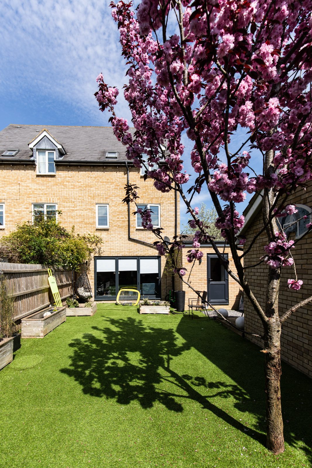 The bright, modern open-plan kitchen and living area in a Cambourne family home after a single-storey extension.